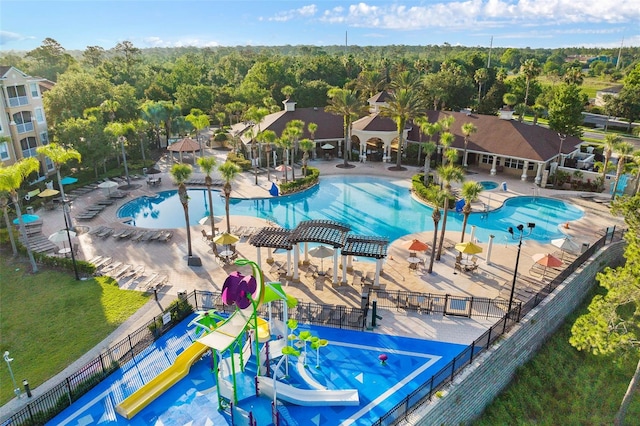 view of swimming pool featuring a patio area and a water slide