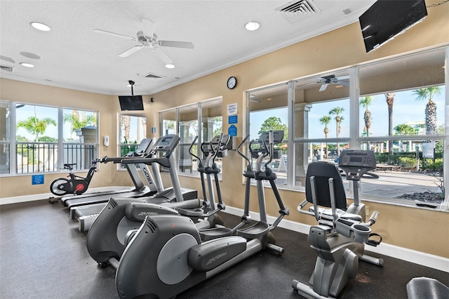 gym with ornamental molding, a textured ceiling, and ceiling fan