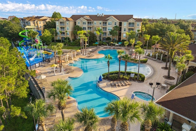 view of pool featuring a patio area and a hot tub