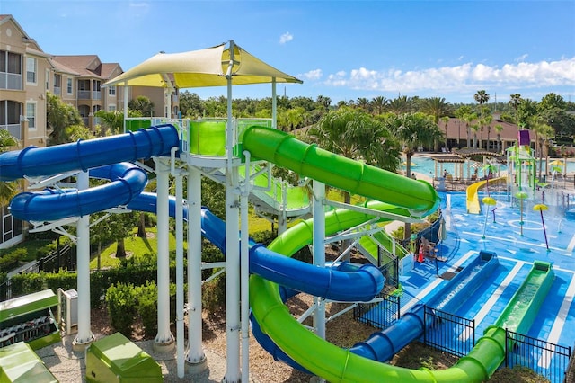 view of jungle gym featuring a community pool