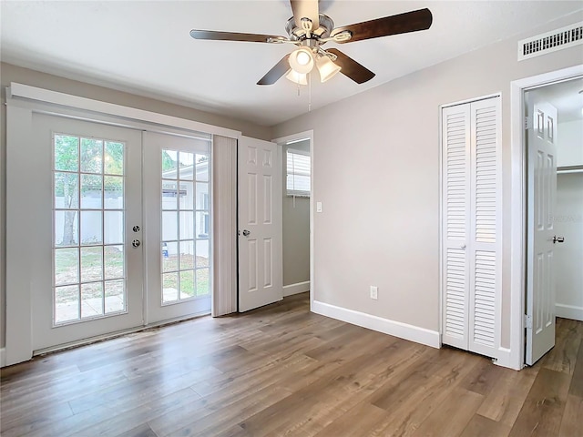 doorway with french doors, hardwood / wood-style flooring, and ceiling fan