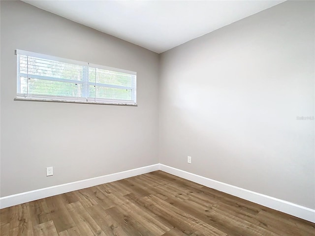 empty room with wood-type flooring