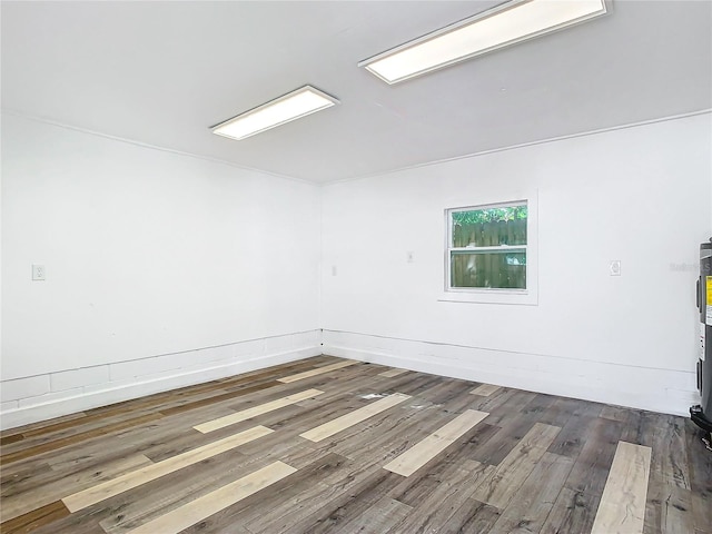 empty room with dark wood-type flooring