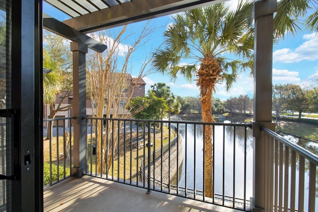 balcony featuring a water view