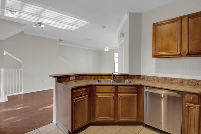 kitchen featuring sink, ornamental molding, stainless steel dishwasher, light tile patterned floors, and ceiling fan