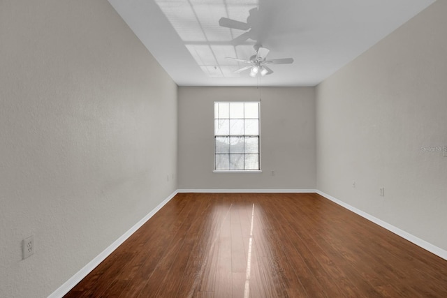 empty room featuring wood-type flooring and ceiling fan