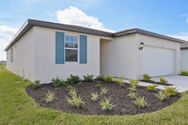 ranch-style home featuring a garage, concrete driveway, a front lawn, and stucco siding