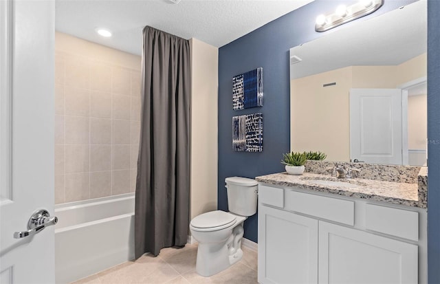 full bathroom with tile patterned floors, toilet, shower / bath combination with curtain, vanity, and a textured ceiling