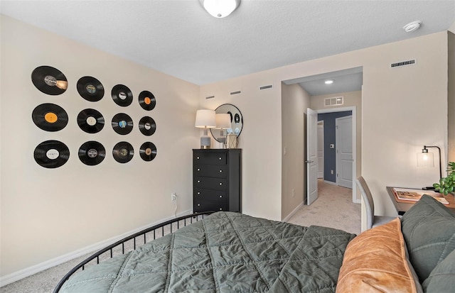 carpeted bedroom featuring a textured ceiling