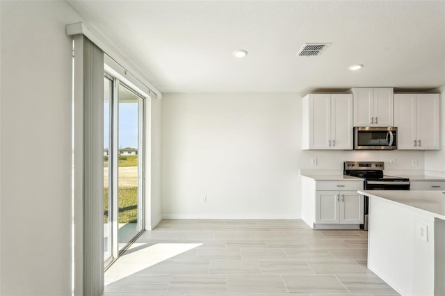 kitchen with white cabinetry and stainless steel appliances