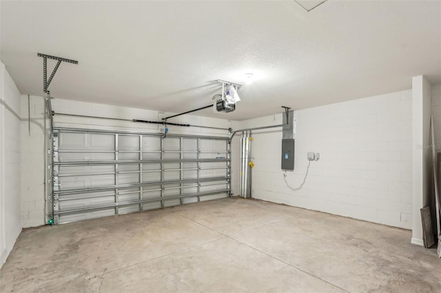 garage with electric panel and a garage door opener