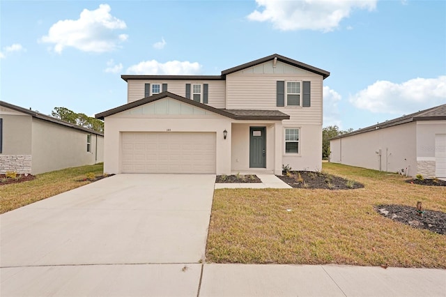 view of front of property with a front yard and a garage