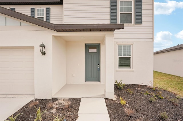 doorway to property featuring a garage