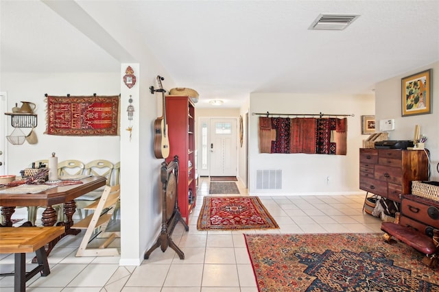 entryway featuring light tile patterned floors