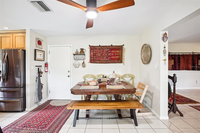 dining room featuring ceiling fan and light tile patterned floors