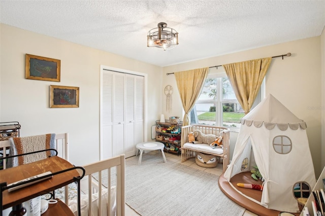 bedroom featuring a closet and a textured ceiling