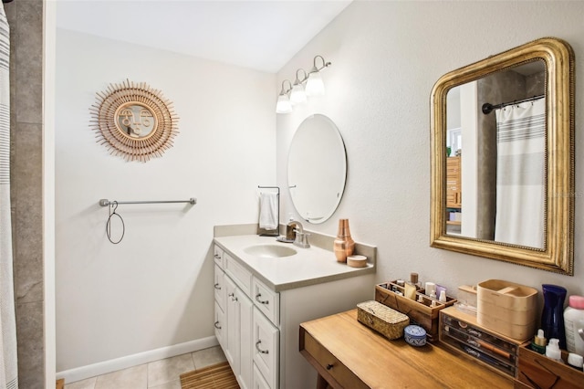 bathroom featuring vanity, vaulted ceiling, and tile patterned flooring