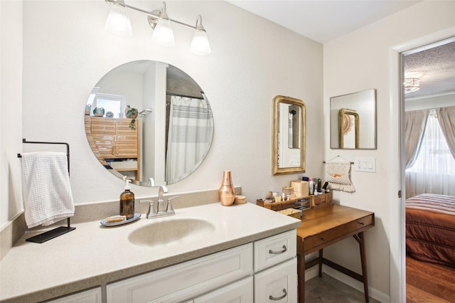 bathroom with vanity and a textured ceiling