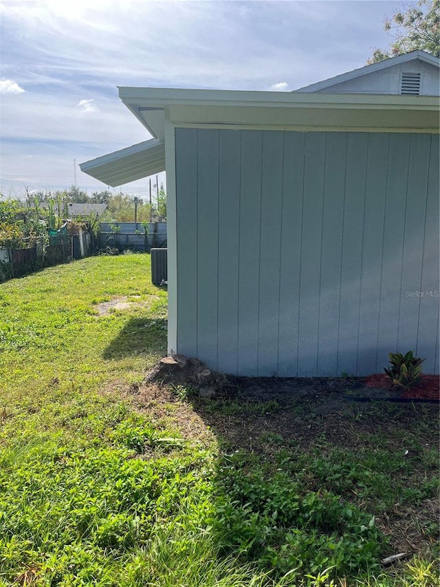 view of side of home featuring a yard