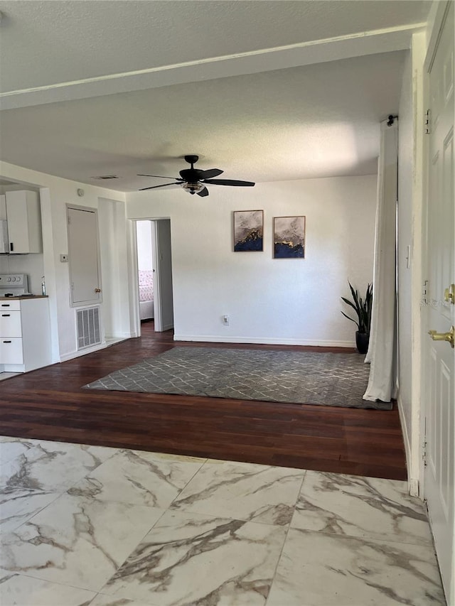 interior space featuring hardwood / wood-style flooring and ceiling fan