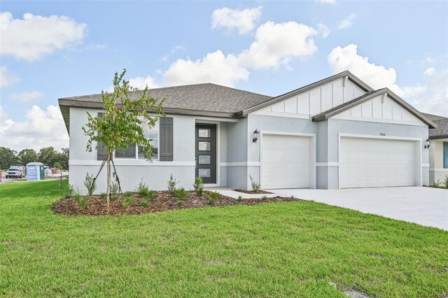 view of front facade with a garage and a front yard