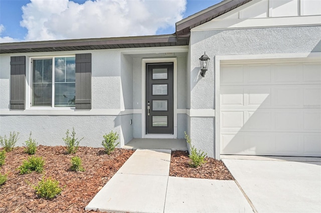 property entrance with a garage