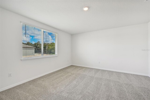 empty room with carpet flooring