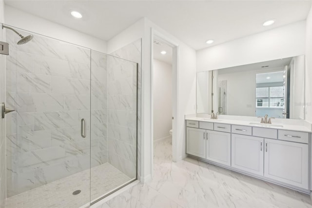 bathroom with vanity, toilet, and walk in shower