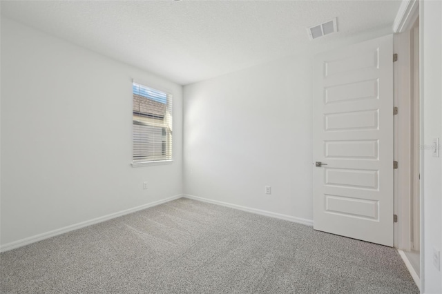 unfurnished room featuring carpet flooring