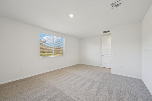 spare room featuring carpet