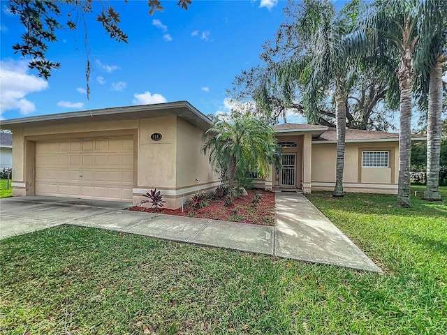 view of front of property with a garage and a front yard