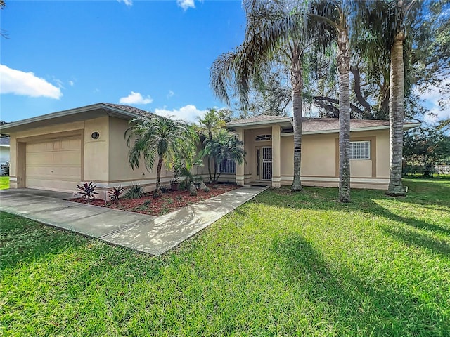 view of front of home with a front lawn and a garage