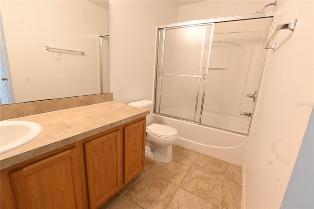 full bathroom with bath / shower combo with glass door, toilet, and vanity