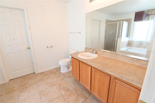 full bathroom featuring toilet, shower with separate bathtub, and vanity