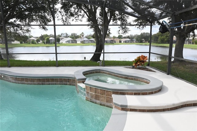 view of pool with a water view, a lanai, and an in ground hot tub