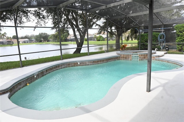 view of pool featuring an in ground hot tub, a patio area, glass enclosure, and a water view