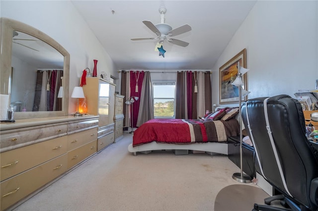 carpeted bedroom with ceiling fan and lofted ceiling