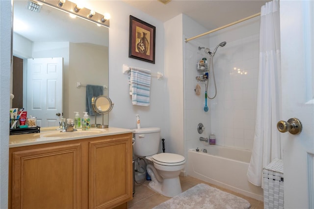 full bathroom featuring tile patterned flooring, vanity, toilet, and shower / bath combo with shower curtain