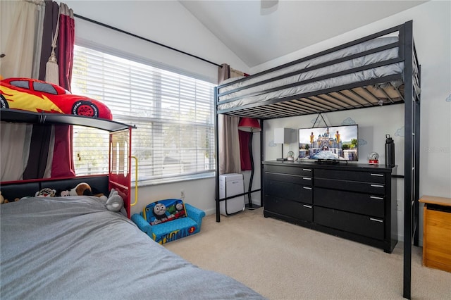 carpeted bedroom featuring vaulted ceiling