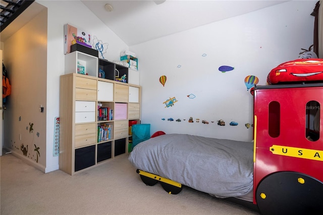 carpeted bedroom featuring vaulted ceiling