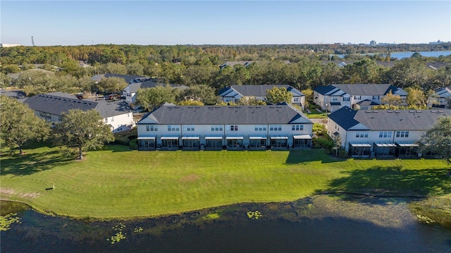 birds eye view of property with a water view