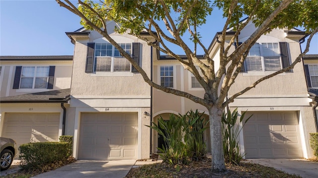 multi unit property featuring a garage