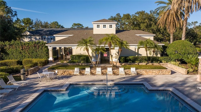 view of swimming pool featuring a patio area