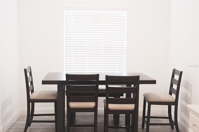 dining room with hardwood / wood-style floors