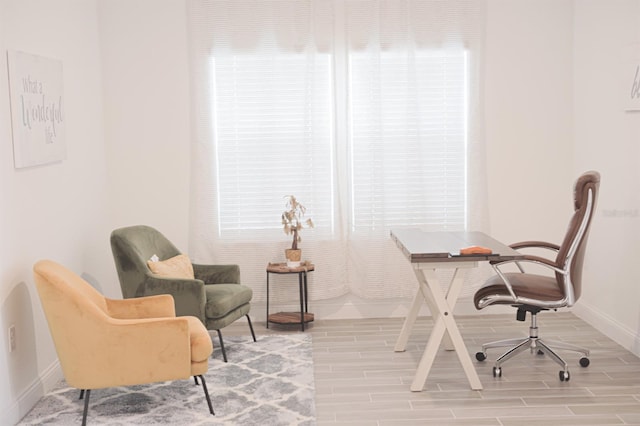 home office with wood-type flooring