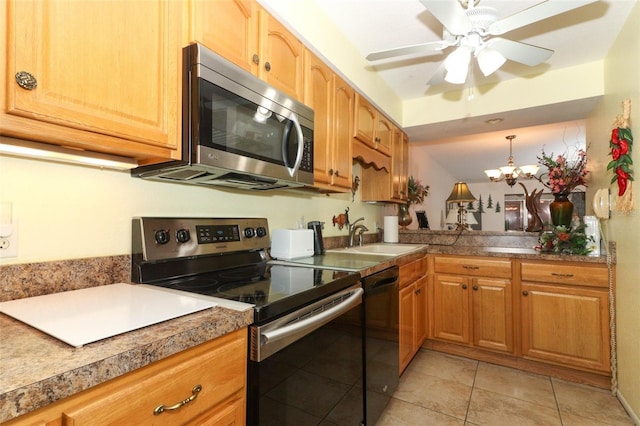 kitchen with stainless steel appliances, a sink, light tile patterned floors, ceiling fan, and decorative light fixtures