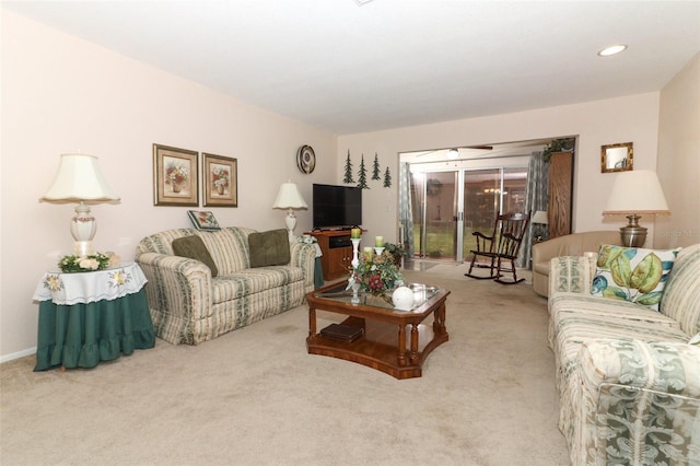 carpeted living area featuring recessed lighting