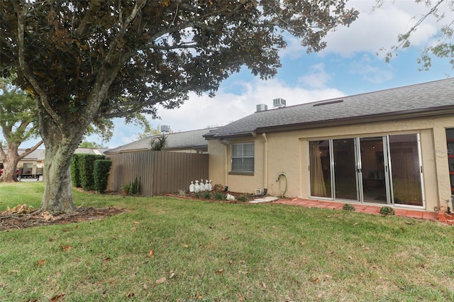 back of property with stucco siding