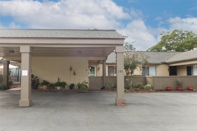 view of parking / parking lot with a carport