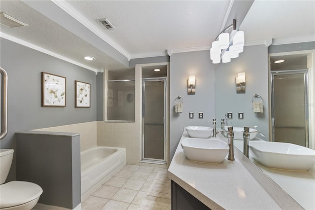 full bathroom featuring vanity, separate shower and tub, toilet, and tile patterned floors